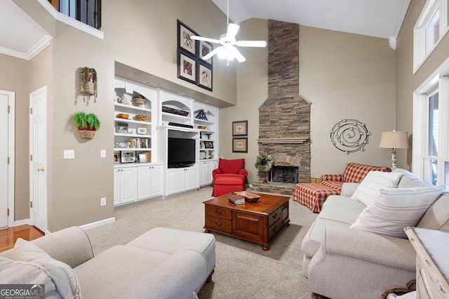 138 Knightwood Pt, Acworth, GA 30101 - living area with high vaulted ceiling, ceiling fan, a fireplace, light carpet, and baseboards