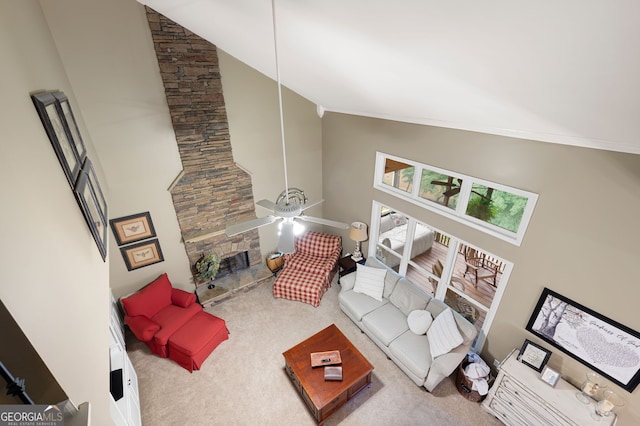 138 Knightwood Pt, Acworth, GA 30101 - carpeted living area with high vaulted ceiling, a ceiling fan, and a fireplace