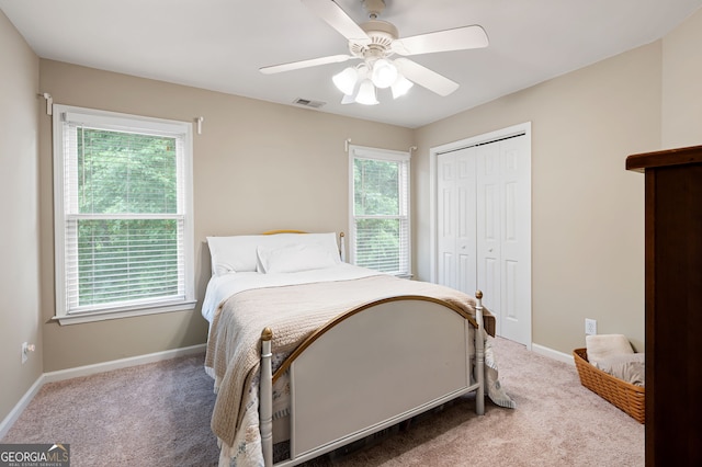 138 Knightwood Pt, Acworth, GA 30101 - carpeted bedroom featuring multiple windows, a closet, and baseboards