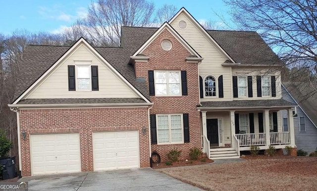 138 Knightwood Pt, Acworth, GA 30101 - traditional-style home featuring a porch, driveway, a shingled roof, and brick siding