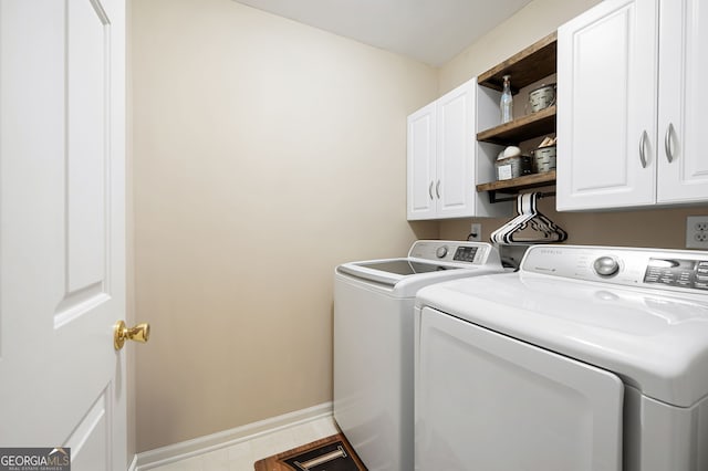 138 Knightwood Pt, Acworth, GA 30101 - laundry area featuring washer and clothes dryer, cabinet space, and baseboards