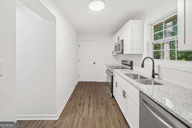 5155 Oakdale Ct, Douglasville, GA 30135 - kitchen featuring stainless steel appliances, a sink, dark wood finished floors, and light stone countertops