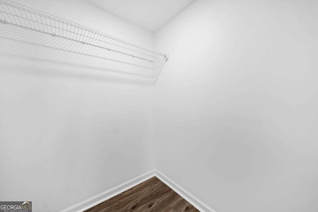 5155 Oakdale Ct, Douglasville, GA 30135 - spacious closet featuring dark wood-style floors
