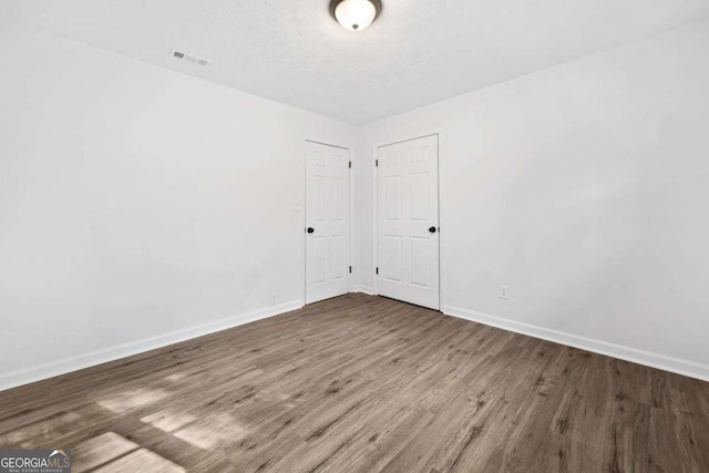 5155 Oakdale Ct, Douglasville, GA 30135 - empty room with baseboards and wood finished floors