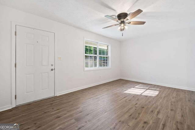 5155 Oakdale Ct, Douglasville, GA 30135 - entryway with wood finished floors, baseboards, ceiling fan, and a textured ceiling