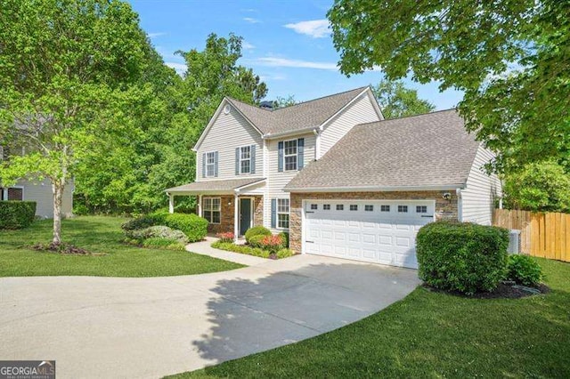 182 Garden Manor Ct, Loganville, GA 30052 - traditional-style house with a garage, concrete driveway, and stone siding