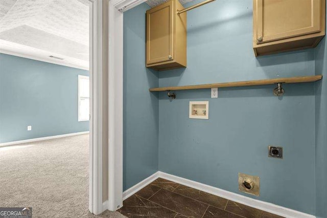 182 Garden Manor Ct, Loganville, GA 30052 - laundry room with hookup for an electric dryer, washer hookup, cabinet space, and dark marble finish floors