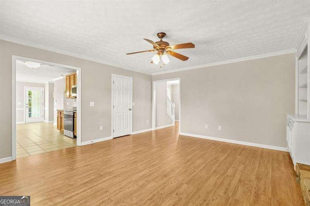 182 Garden Manor Ct, Loganville, GA 30052 - unfurnished room with ceiling fan, light wood-style floors, a textured ceiling, and ornamental molding