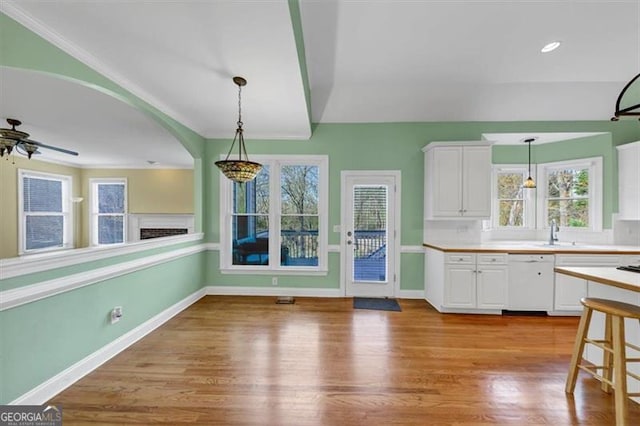 10890 Regal Frst, Suwanee, GA 30024 - kitchen featuring dishwasher, white cabinetry, decorative light fixtures, and plenty of natural light