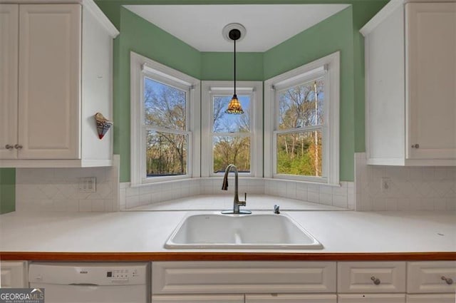 10890 Regal Frst, Suwanee, GA 30024 - kitchen featuring dishwasher, a sink, white cabinetry, and healthy amount of natural light