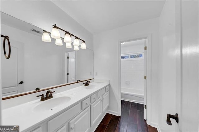 10890 Regal Frst, Suwanee, GA 30024 - bathroom with wood finished floors, double vanity, and baseboards