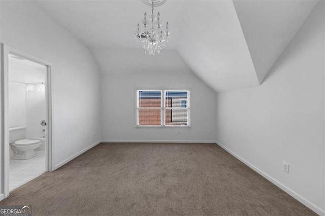10890 Regal Frst, Suwanee, GA 30024 - additional living space with lofted ceiling, carpet floors, baseboards, and a chandelier