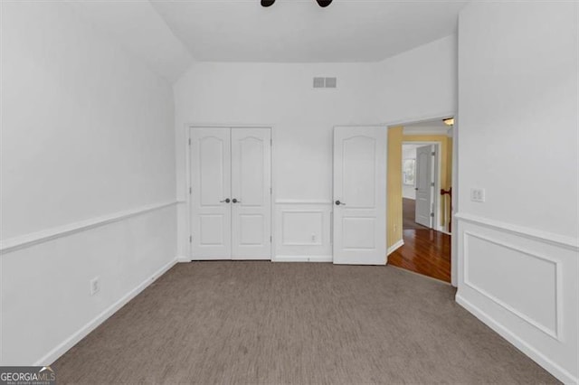 10890 Regal Frst, Suwanee, GA 30024 - unfurnished bedroom with carpet floors, vaulted ceiling, a closet, and ceiling fan