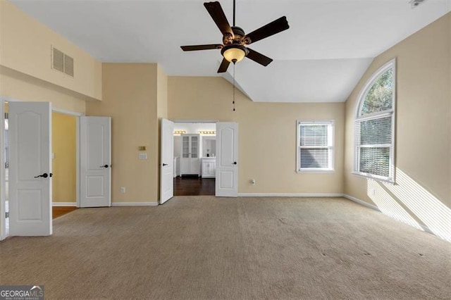 10890 Regal Frst, Suwanee, GA 30024 - unfurnished bedroom featuring carpet, baseboards, connected bathroom, ceiling fan, and high vaulted ceiling