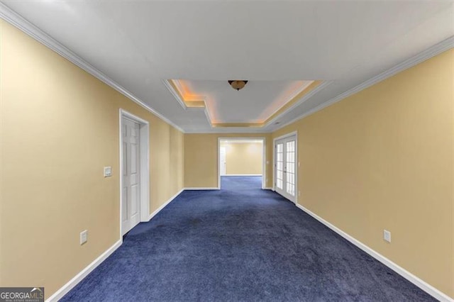 10890 Regal Frst, Suwanee, GA 30024 - spare room with dark colored carpet, baseboards, crown molding, and a raised ceiling