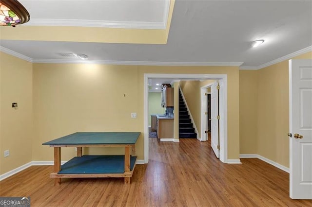 10890 Regal Frst, Suwanee, GA 30024 - recreation room with wood finished floors, baseboards, and crown molding