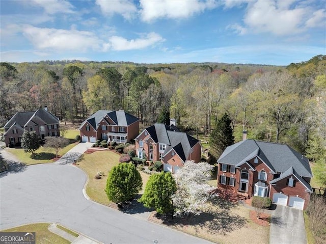 10890 Regal Frst, Suwanee, GA 30024 - aerial perspective of suburban area featuring a heavily wooded area