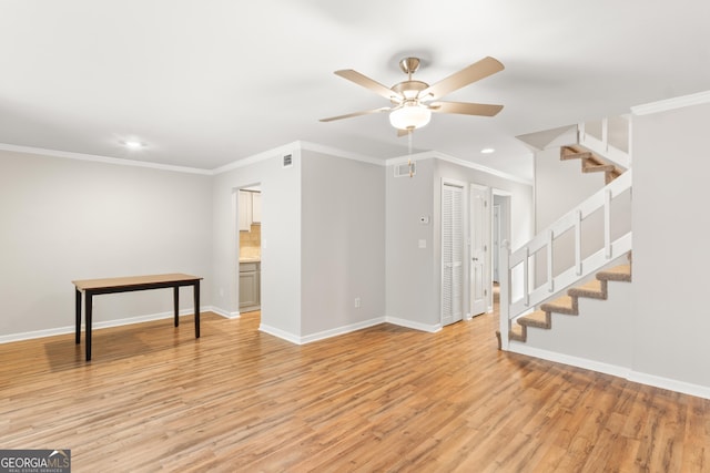 unfurnished living room with stairs, a ceiling fan, recessed lighting, light wood-type flooring, and baseboards