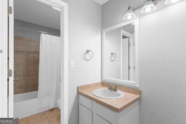 full bathroom with tile patterned floors, vanity, toilet, and shower / bath combo