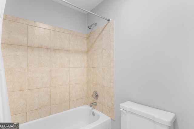 full bathroom featuring bathing tub / shower combination and toilet