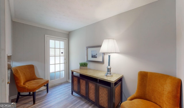 2628 Hickory Trl, Snellville, GA 30078 - sitting room featuring light wood-style floors, baseboards, and ornamental molding