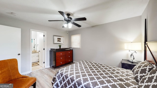 2628 Hickory Trl, Snellville, GA 30078 - bedroom with wood finished floors, baseboards, ensuite bathroom, and a ceiling fan