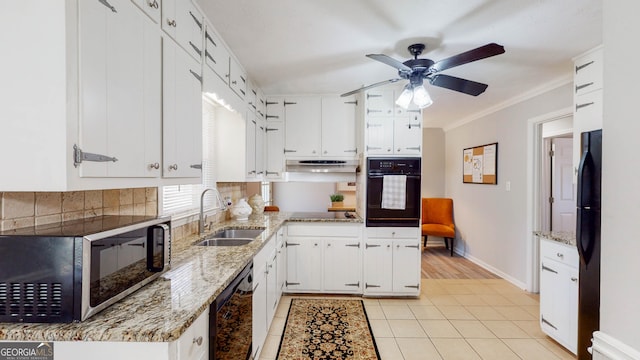 2628 Hickory Trl, Snellville, GA 30078 - kitchen with black appliances, a sink, white cabinets, a ceiling fan, and light tile patterned floors