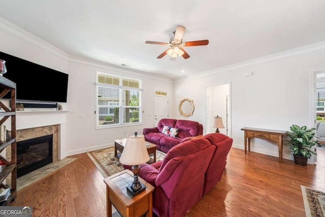 306 Cherokee Station Cir, Woodstock, GA 30188 - living room featuring a ceiling fan, crown molding, a high end fireplace, and wood finished floors