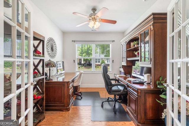 306 Cherokee Station Cir, Woodstock, GA 30188 - office with french doors, light wood finished floors, and ceiling fan