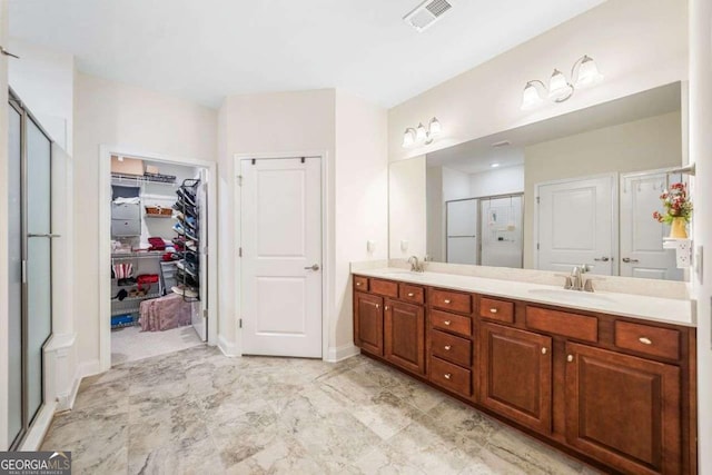 306 Cherokee Station Cir, Woodstock, GA 30188 - bathroom with a shower stall, double vanity, and a walk in closet