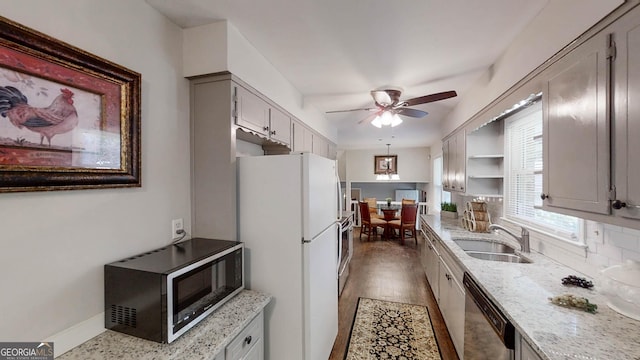 4244 Dorsey Ct SW, Lilburn, GA 30047 - kitchen with stainless steel appliances, a sink, gray cabinets, and ceiling fan