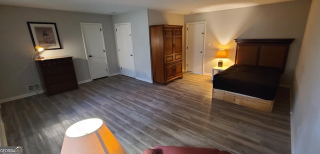 4244 Dorsey Ct SW, Lilburn, GA 30047 - bedroom featuring baseboards and wood finished floors