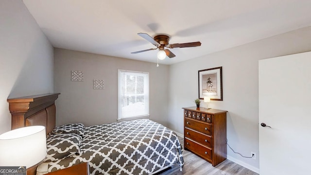 4244 Dorsey Ct SW, Lilburn, GA 30047 - bedroom with light wood-type flooring, baseboards, and ceiling fan