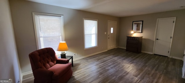 4244 Dorsey Ct SW, Lilburn, GA 30047 - living area with dark wood-style floors and baseboards