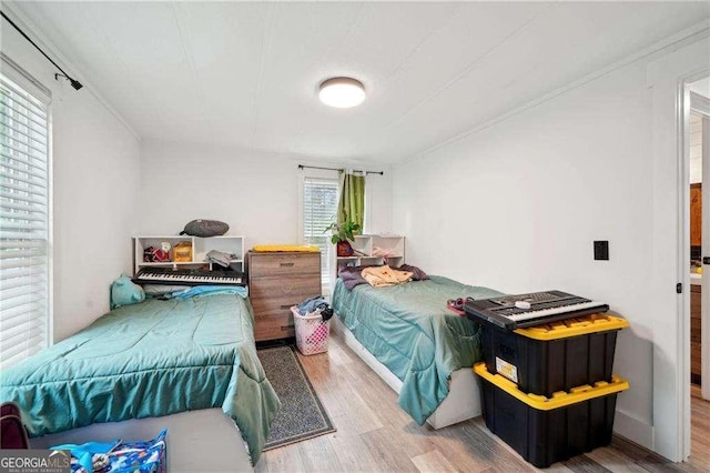 bedroom with wood finished floors