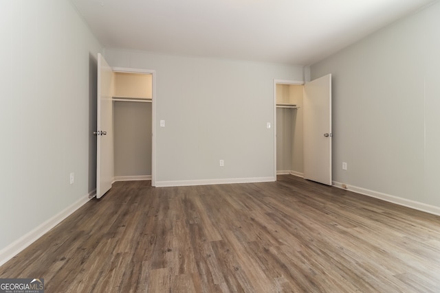 5243 Valleyview Dr, Acworth, GA 30102 - unfurnished bedroom featuring a spacious closet and wood finished floors