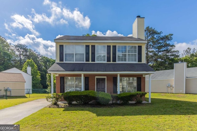 7623 Mcgillicuty Dr, Union City, GA 30291 - traditional-style home with concrete driveway, a porch, and a chimney