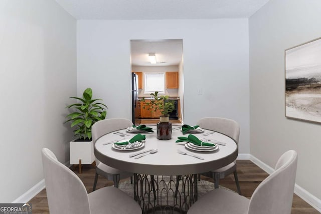 7623 Mcgillicuty Dr, Union City, GA 30291 - dining room with wood finished floors and baseboards