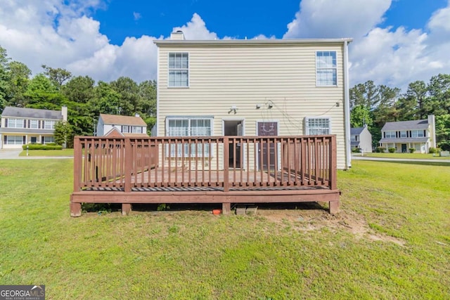 7623 Mcgillicuty Dr, Union City, GA 30291 - rear view of property with a wooden deck, a lawn, and a chimney