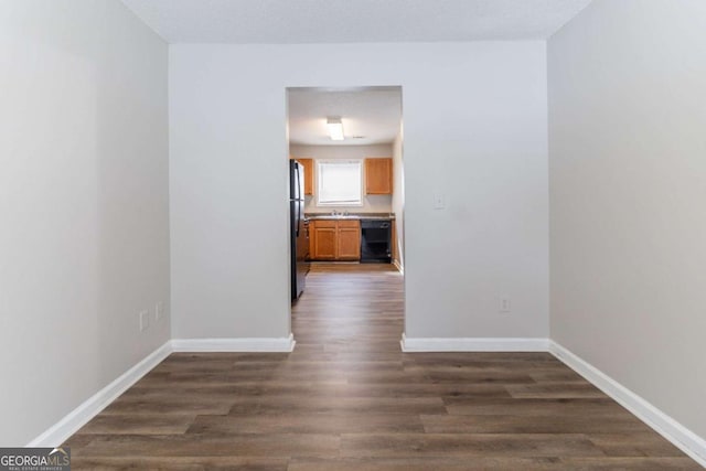 7623 Mcgillicuty Dr, Union City, GA 30291 - unfurnished room featuring baseboards and dark wood-type flooring