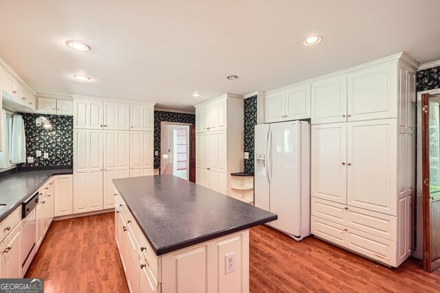 5401 Smoke Rise Dr, Smoke Rise, GA 30087 - kitchen featuring white fridge with ice dispenser, dark countertops, dishwasher, light wood-type flooring, and recessed lighting