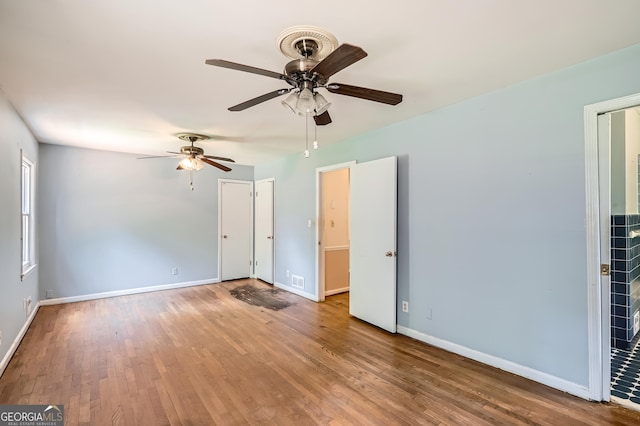 5401 Smoke Rise Dr, Smoke Rise, GA 30087 - unfurnished bedroom with wood finished floors, baseboards, and a ceiling fan