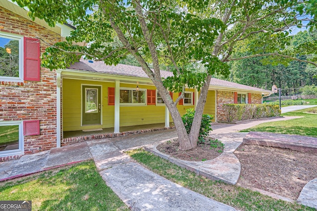 5401 Smoke Rise Dr, Smoke Rise, GA 30087 - view of front of house with brick siding, a shingled roof, and a porch