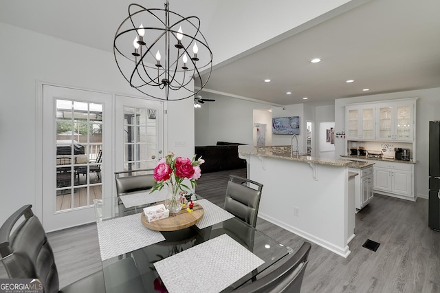 20 Allie Dr, Mcdonough, GA 30252 - dining area with wood finished floors, recessed lighting, and a chandelier