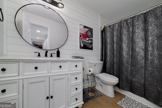 20 Allie Dr, Mcdonough, GA 30252 - full bath with wooden walls, toilet, wood finished floors, and vanity