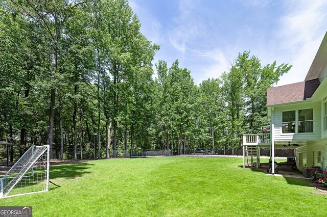 20 Allie Dr, Mcdonough, GA 30252 - view of green lawn with stairway and a wooden deck