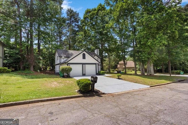 5383 Biffle Way, Stone Mountain, GA 30088 - view of front facade with concrete driveway, a front lawn, and an attached garage