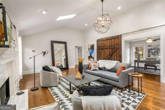 1041 Standard Dr, Brookhaven, GA 30319 - living area with a premium fireplace, a chandelier, wood finished floors, and vaulted ceiling