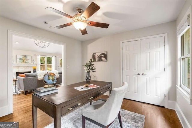 1041 Standard Dr, Brookhaven, GA 30319 - office area with healthy amount of natural light, wood finished floors, and ceiling fan