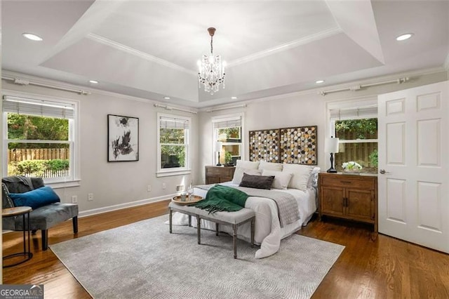 1041 Standard Dr, Brookhaven, GA 30319 - bedroom featuring a raised ceiling, a chandelier, dark wood finished floors, baseboards, and ornamental molding